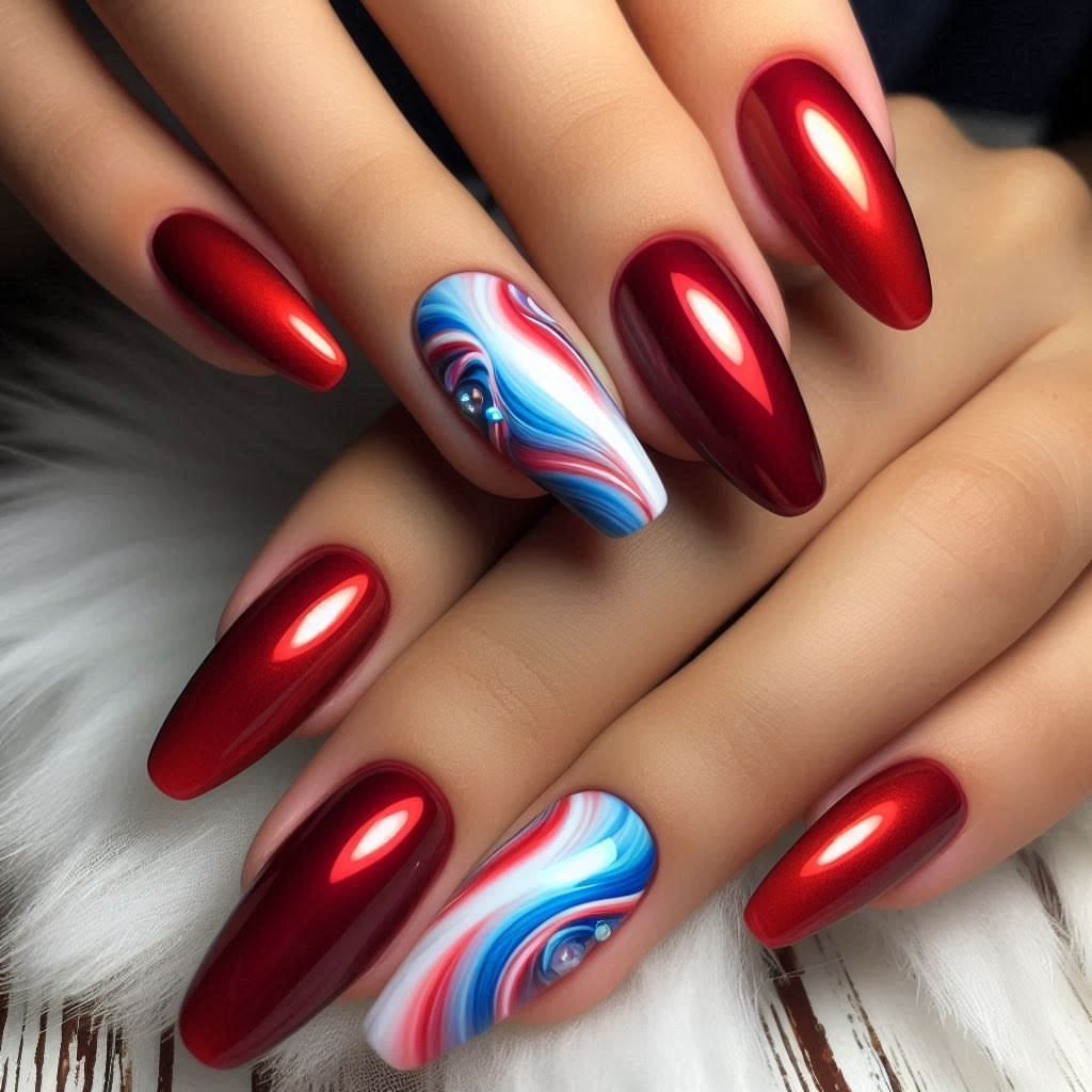 Metallic red and red, white, and blue marbled almond-shaped nails on hands.