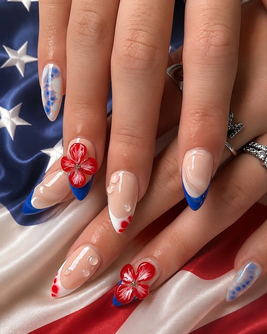 Almond-shaped gel nails with red, white, and blue patriotic art on American flag.