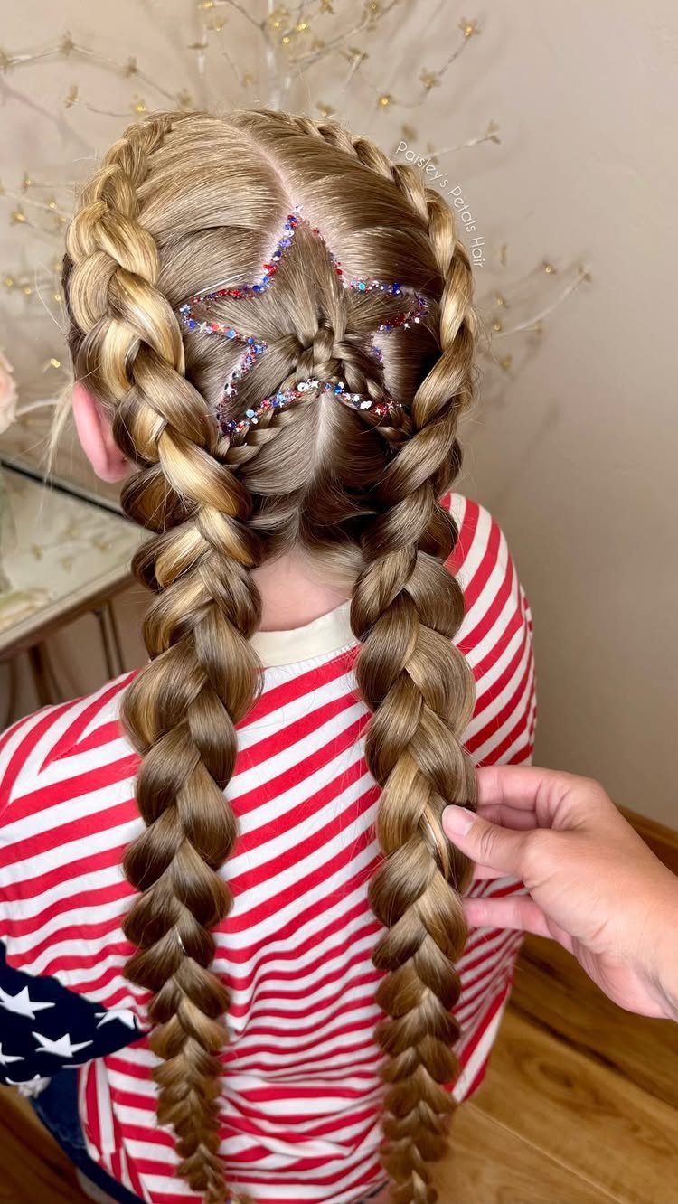 Blonde Dutch braids with a red, white, and blue glitter star design.