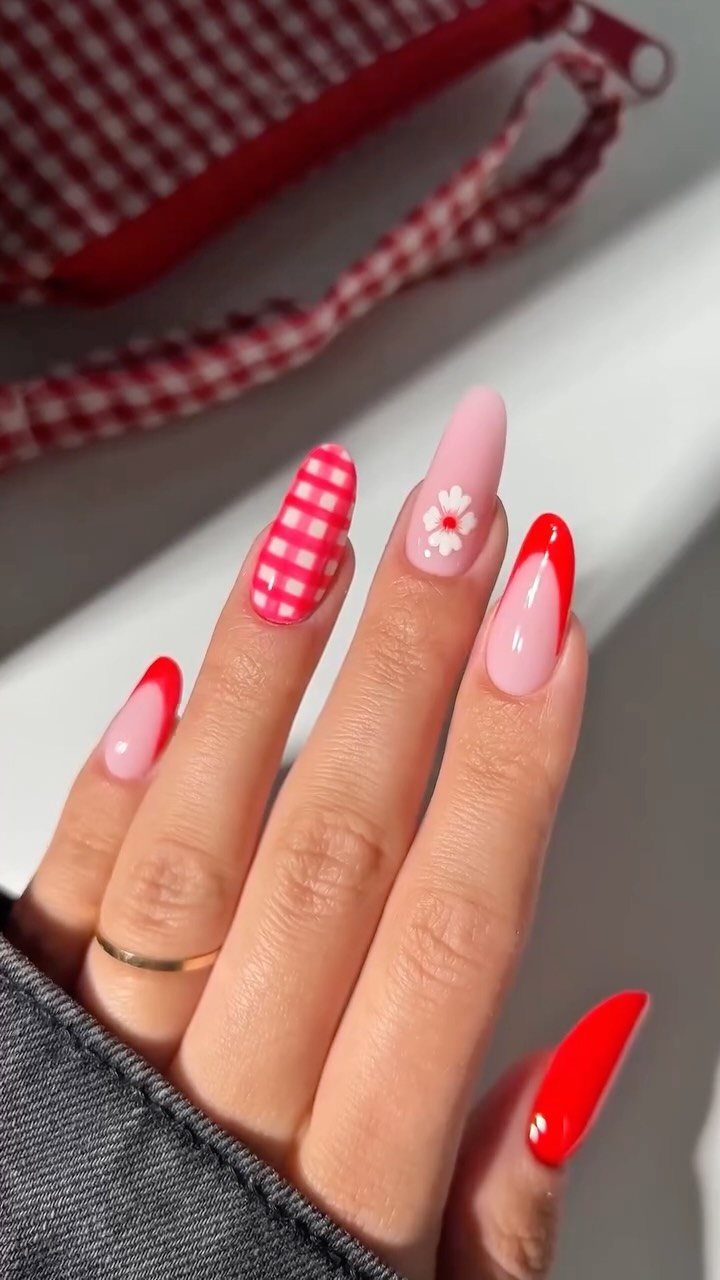 Manicured nails with red and white gingham, floral, and French tip designs.