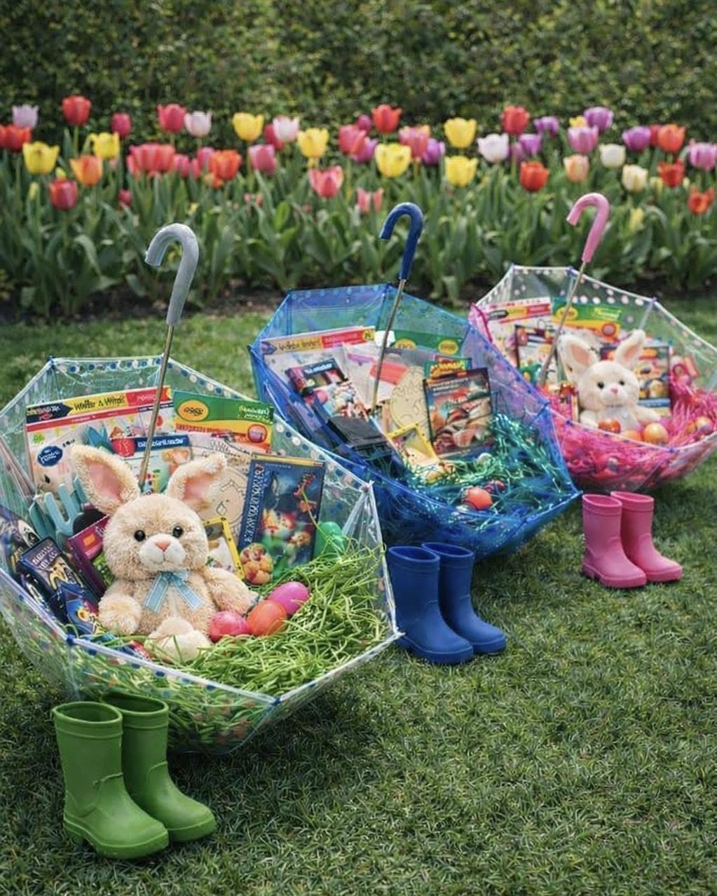 Clear umbrella baskets filled with Easter treats and toys on a grassy lawn