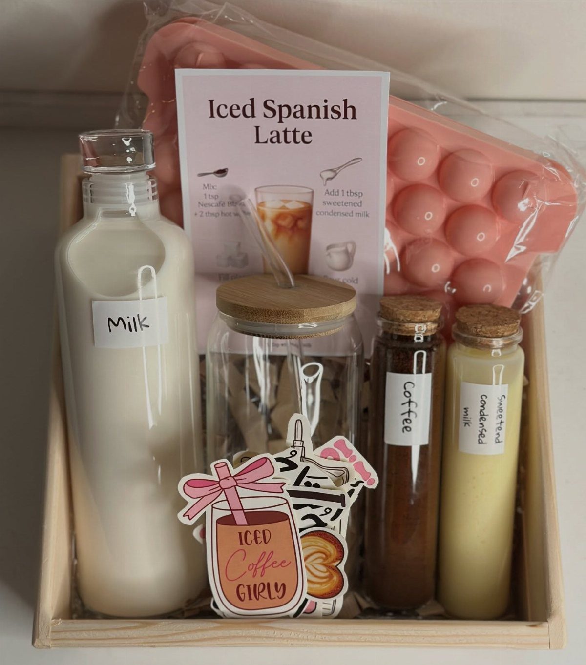 Coffee gift box with milk, coffee, condensed milk, and an iced latte recipe.