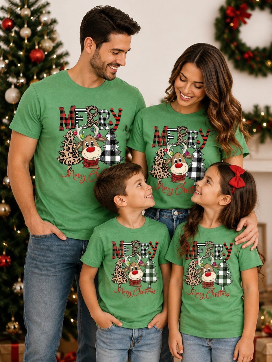 Family wearing matching green Christmas t-shirts standing by a decorated holiday tree.