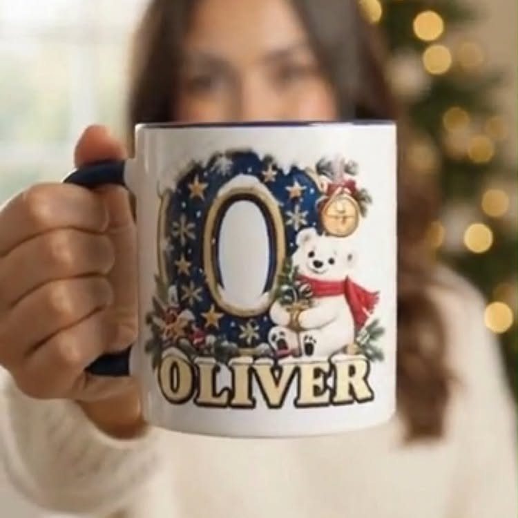 Personalized white ceramic mug with a polar bear and the name Oliver.