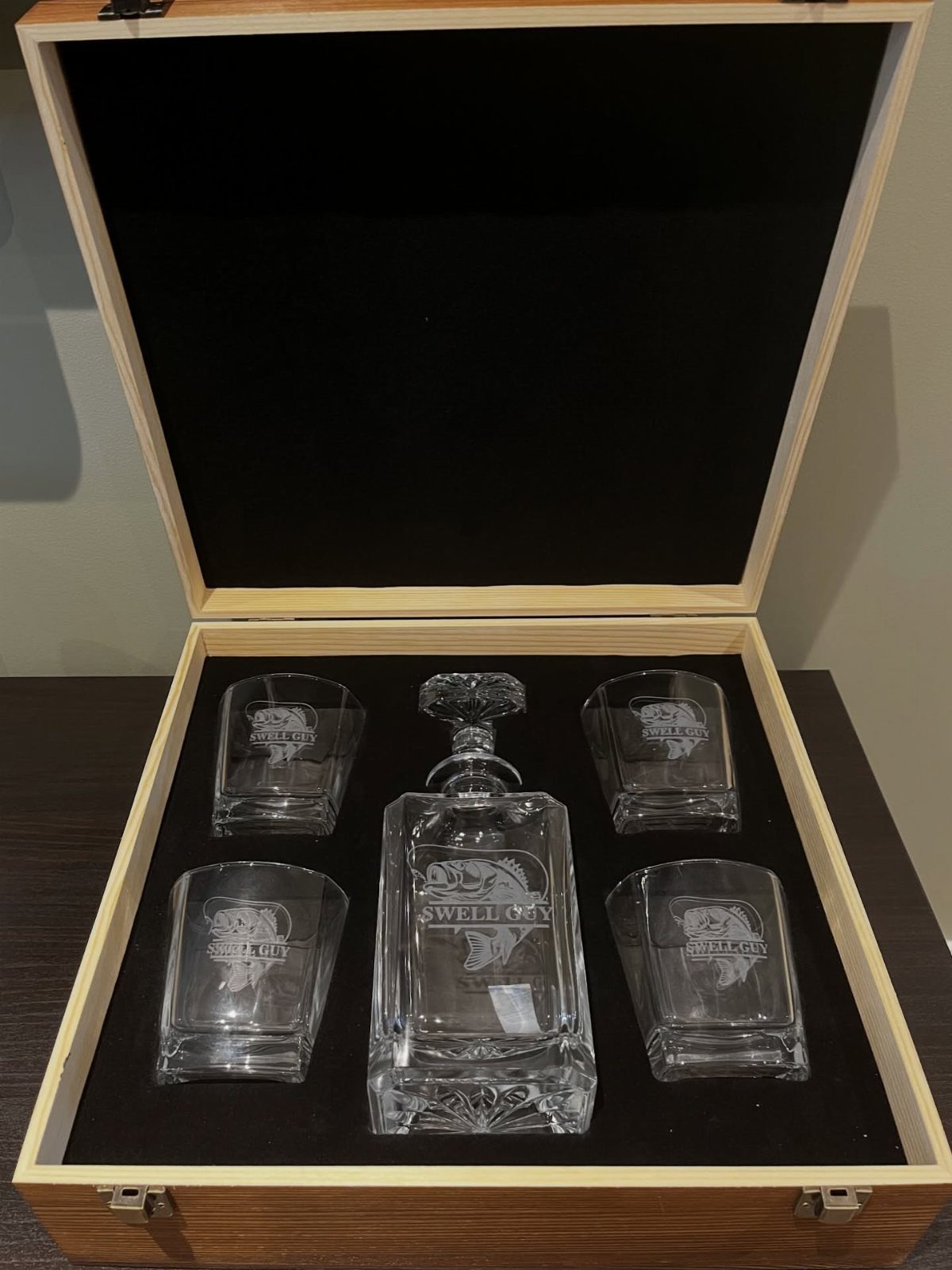 Crystal whiskey decanter and four glasses in a wooden gift box with black lining