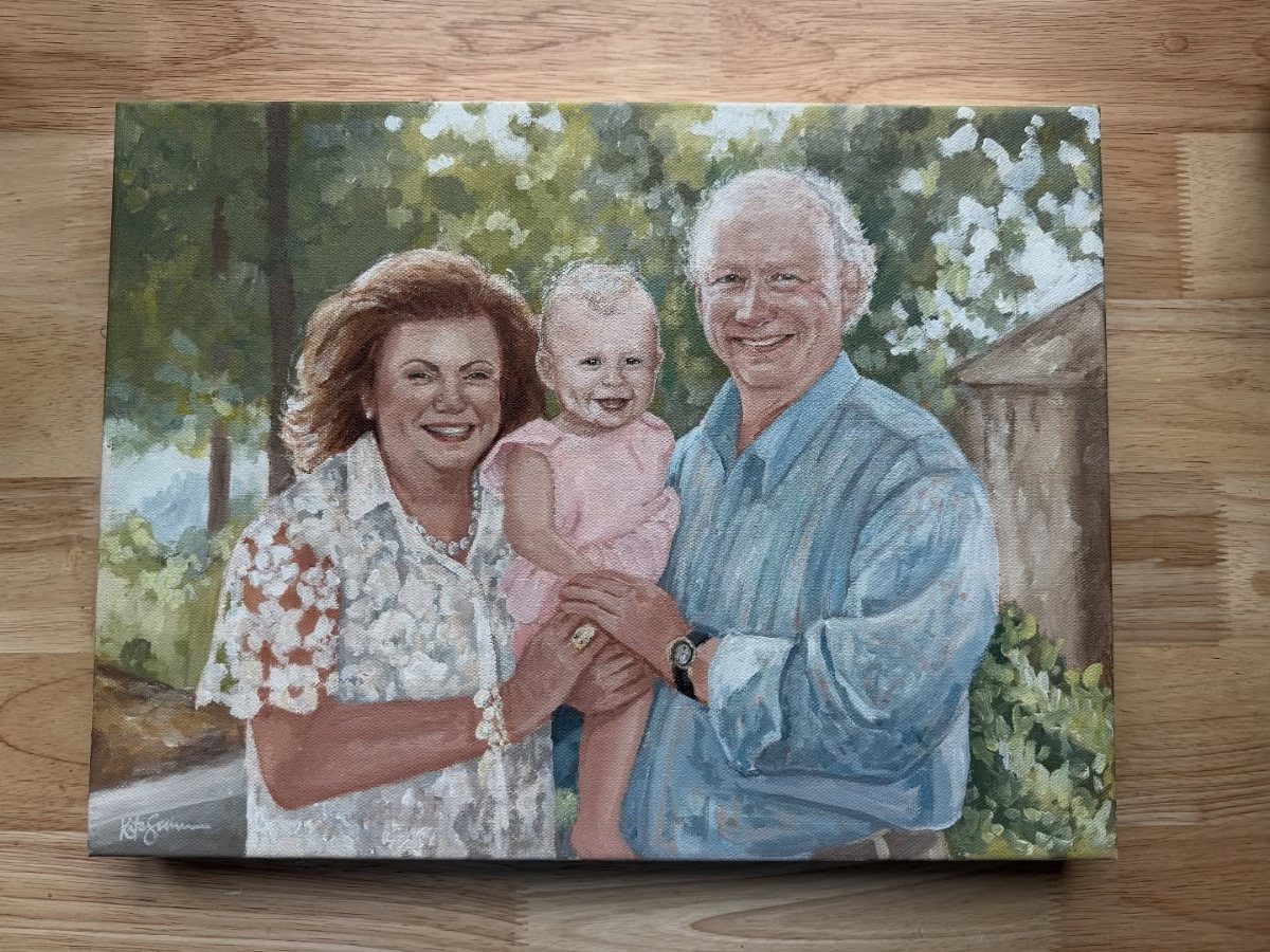 Painted canvas portrait of a family with a woman, man, and baby child.