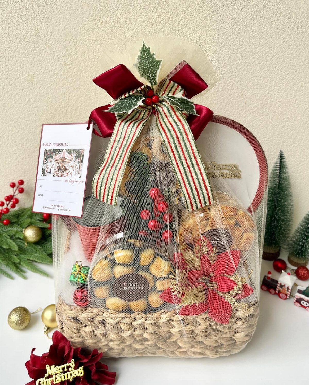 Gourmet food hamper in a woven basket wrapped in cellophane with a red bow.