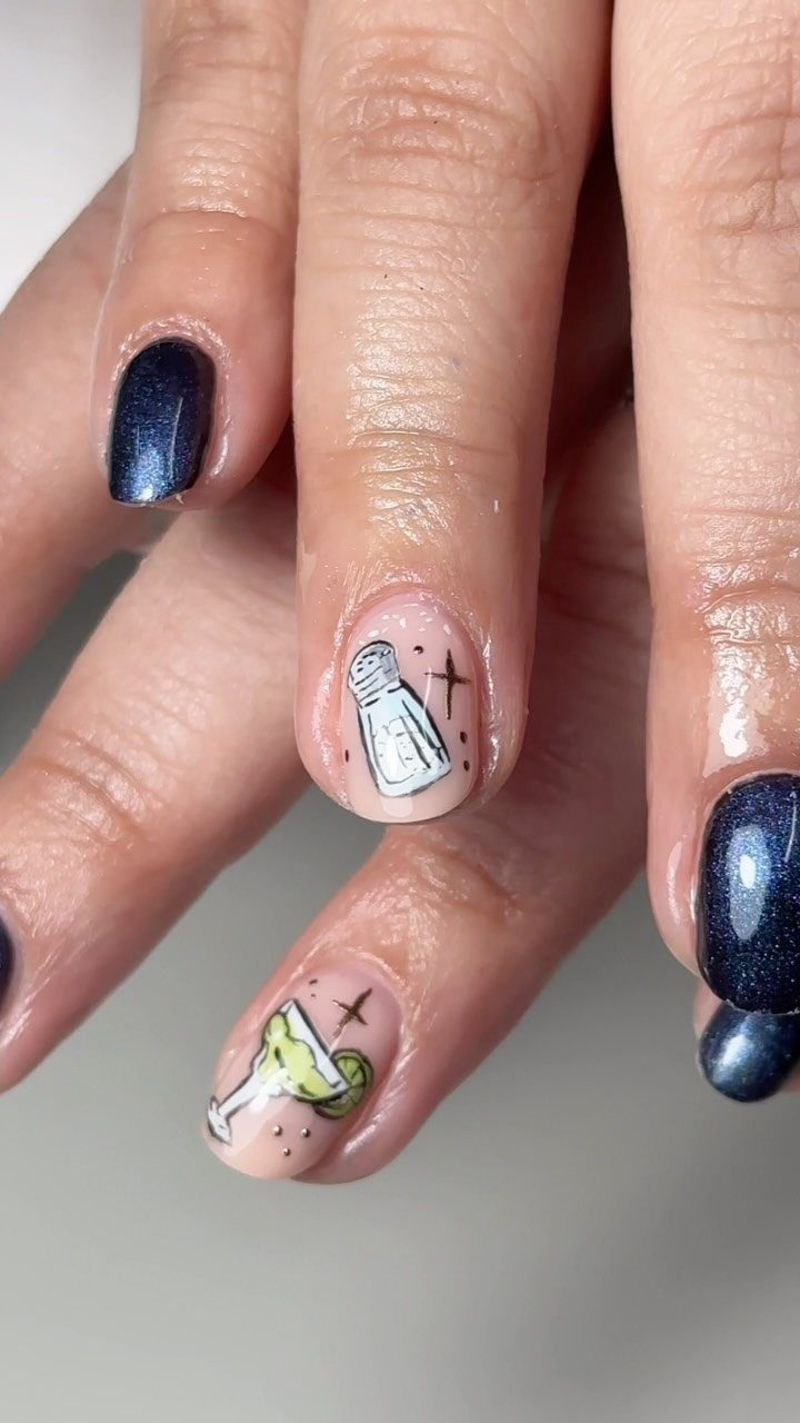 Manicured nails featuring a hand-painted margarita cocktail and salt shaker design.