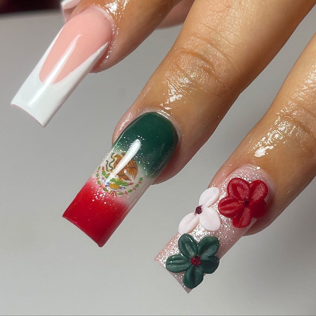 Long coffin nails featuring a Mexican flag gradient and 3D colorful floral accents.