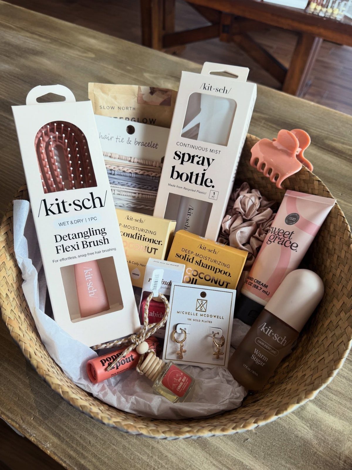 Woven wicker basket filled with beauty products and self-care items on wooden table
