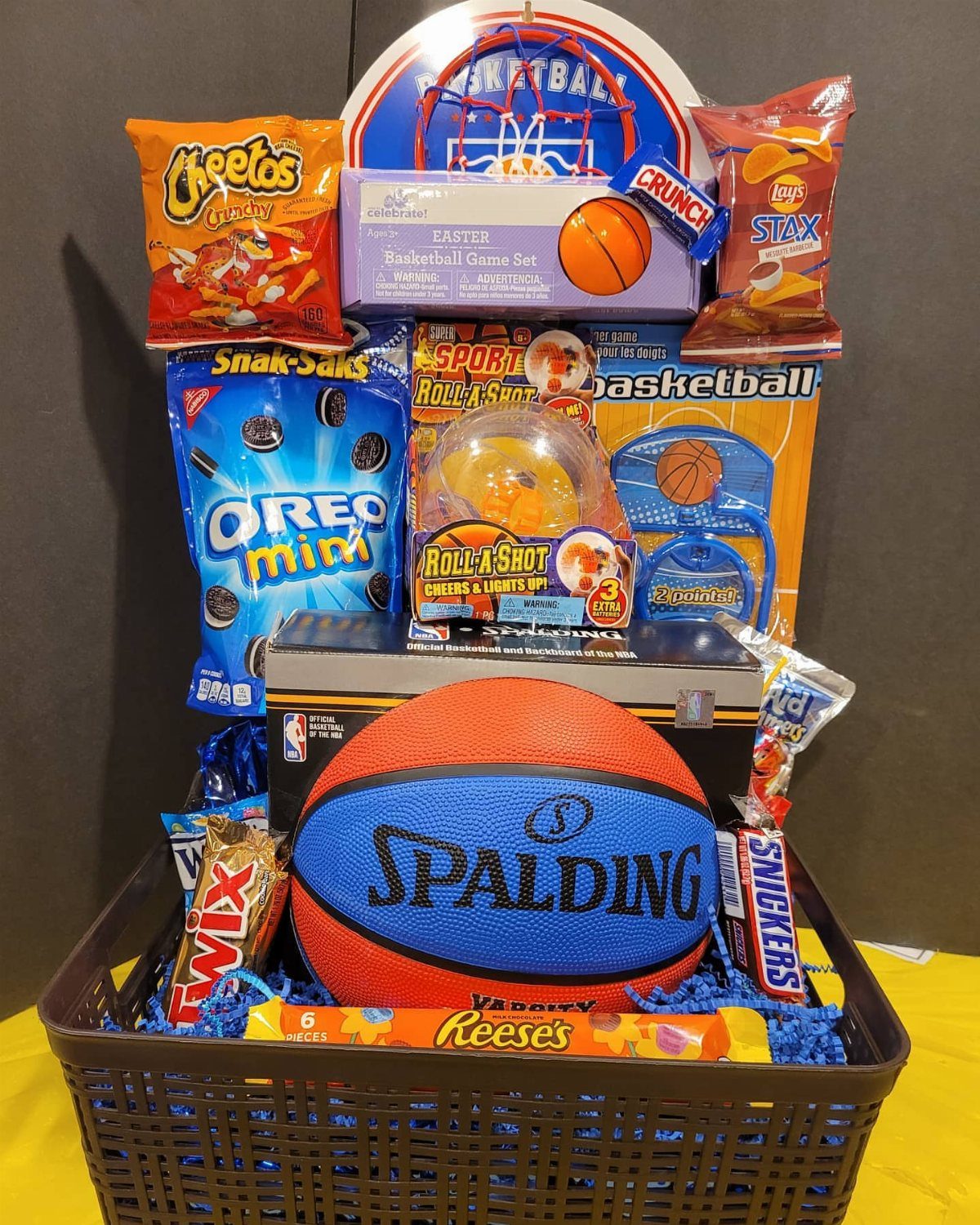 Sports themed Easter basket with a Spalding basketball, snacks, and mini hoop game.