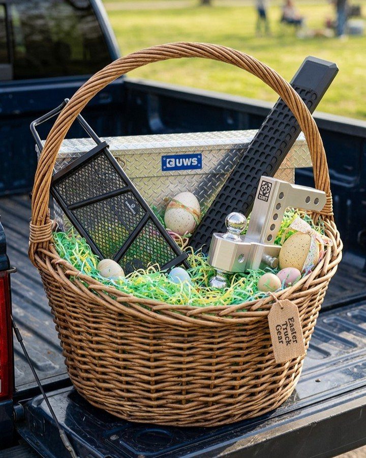Wicker Easter basket filled with truck gear and eggs in a pickup bed