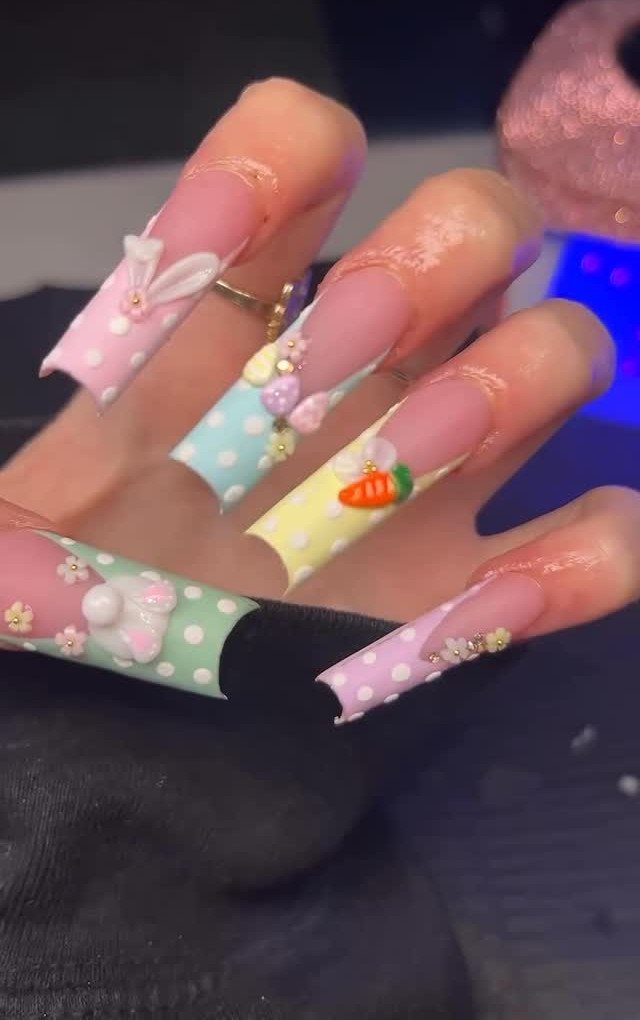 Pastel polka dot nails with 3D bunny ears, carrot, and flower accents.