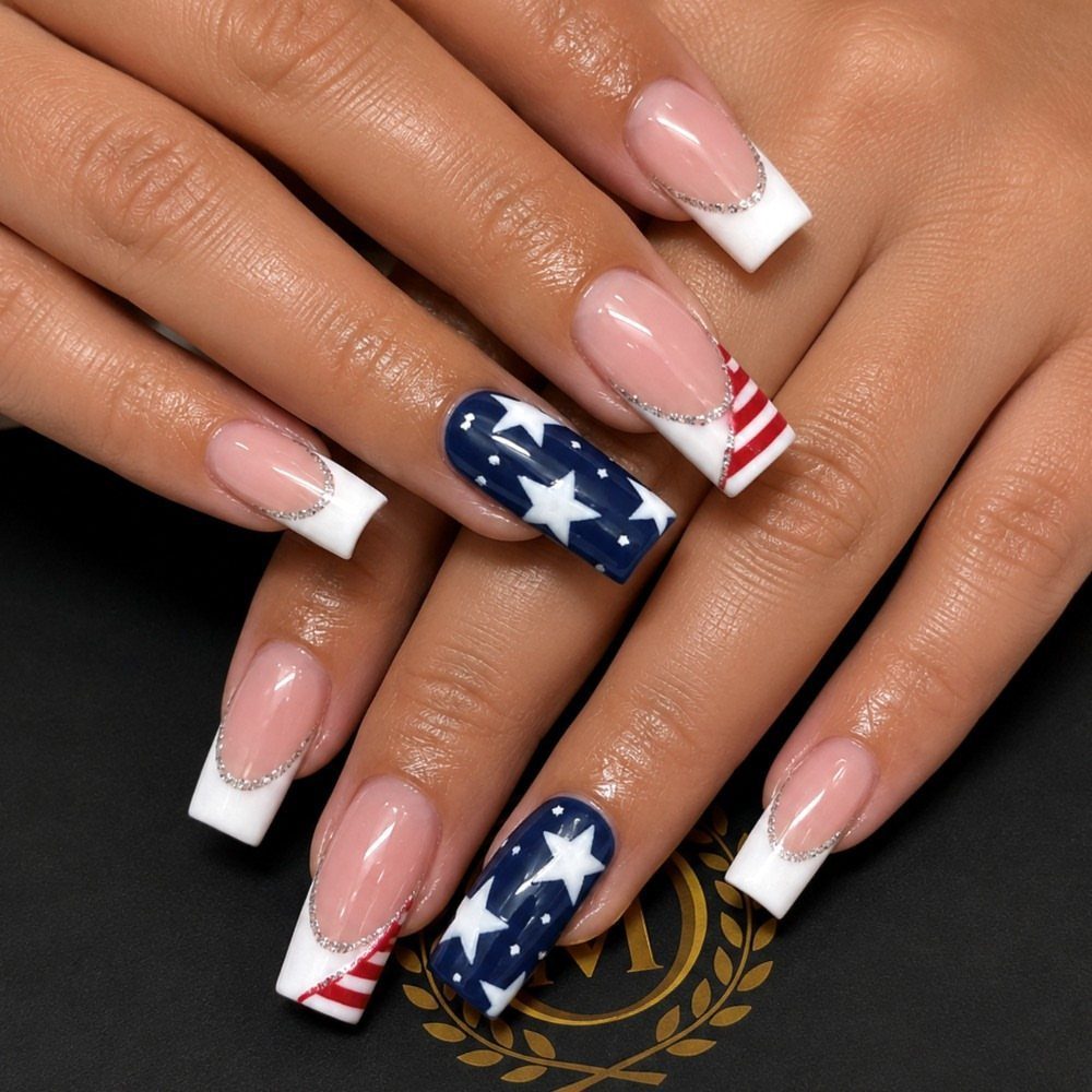 Patriotic square nails with white tips, red and white stripes, and blue star patterns.
