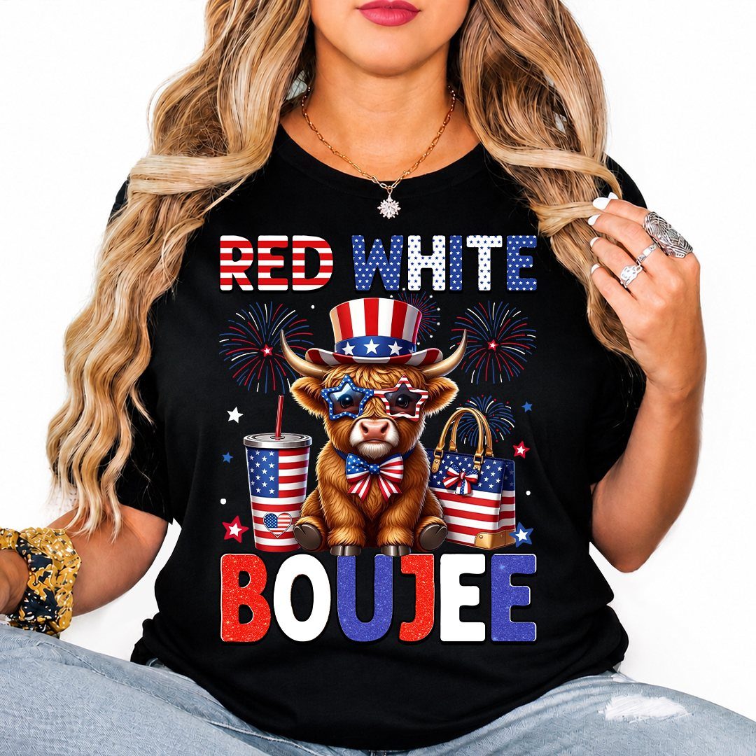 Woman wearing a black patriotic cow graphic tee and light blue denim jeans.