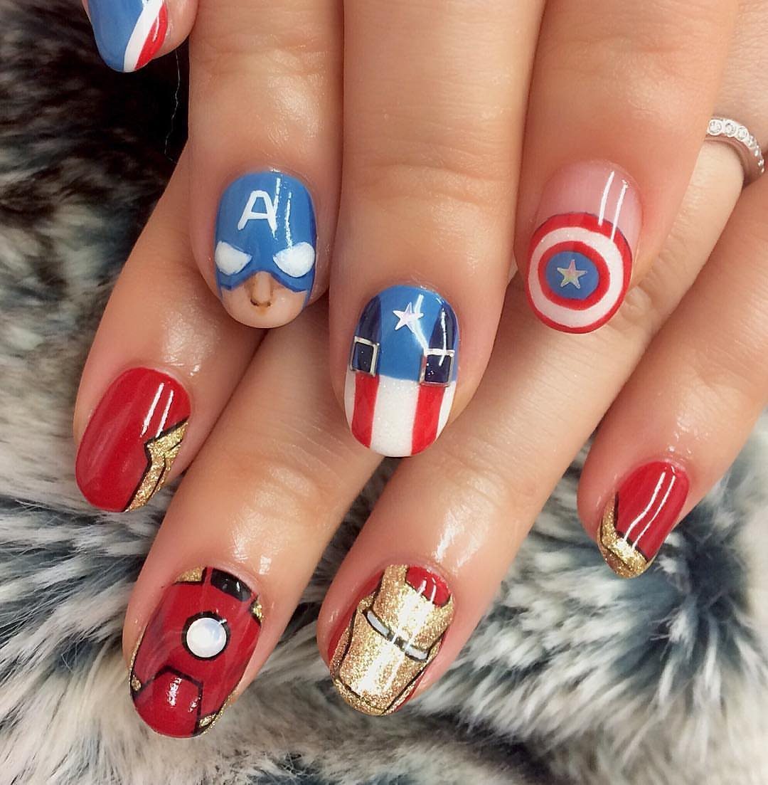 Avengers themed nail art featuring Captain America's shield and Iron Man's helmet designs.