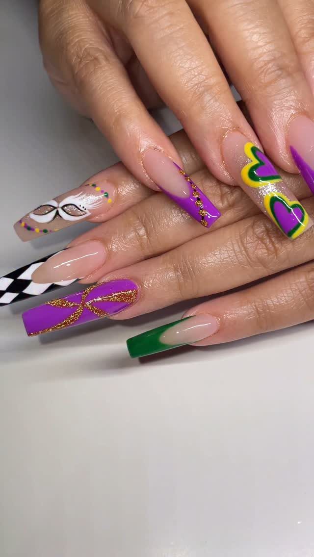 Long coffin nails with purple, green, and gold Mardi Gras themed nail art.