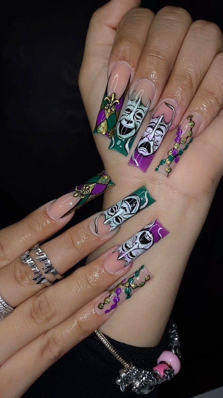 Long coffin nails with purple, green, and gold Mardi Gras mask nail art.