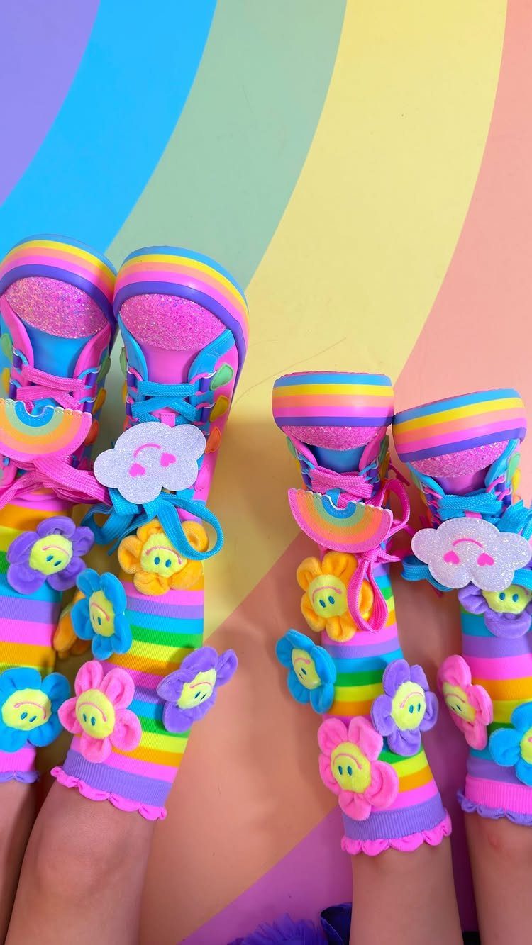 Rainbow striped socks with colorful flower appliques and matching glitter sneakers.