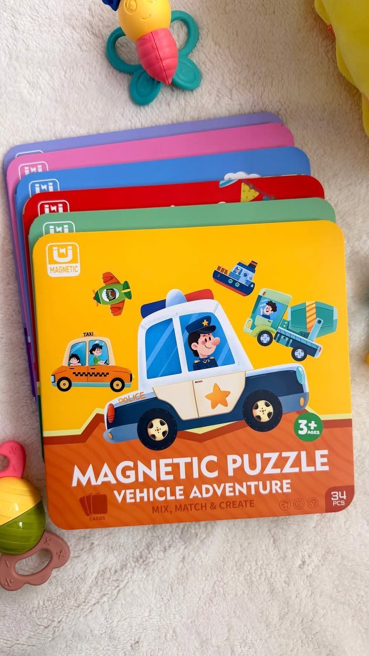 Magnetic puzzle tins with vehicle illustrations stacked on a white textured surface.