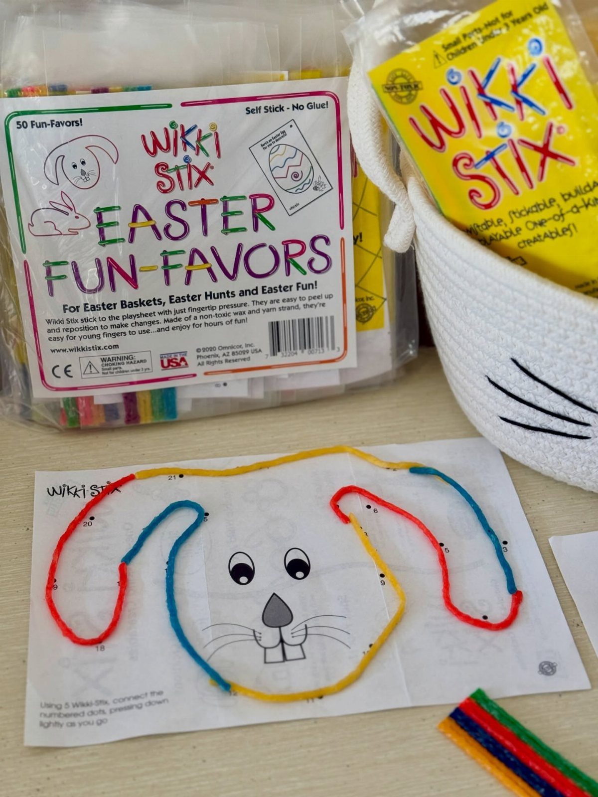 Easter basket fillers including Wikki Stix activity kits and a bunny-shaped basket.