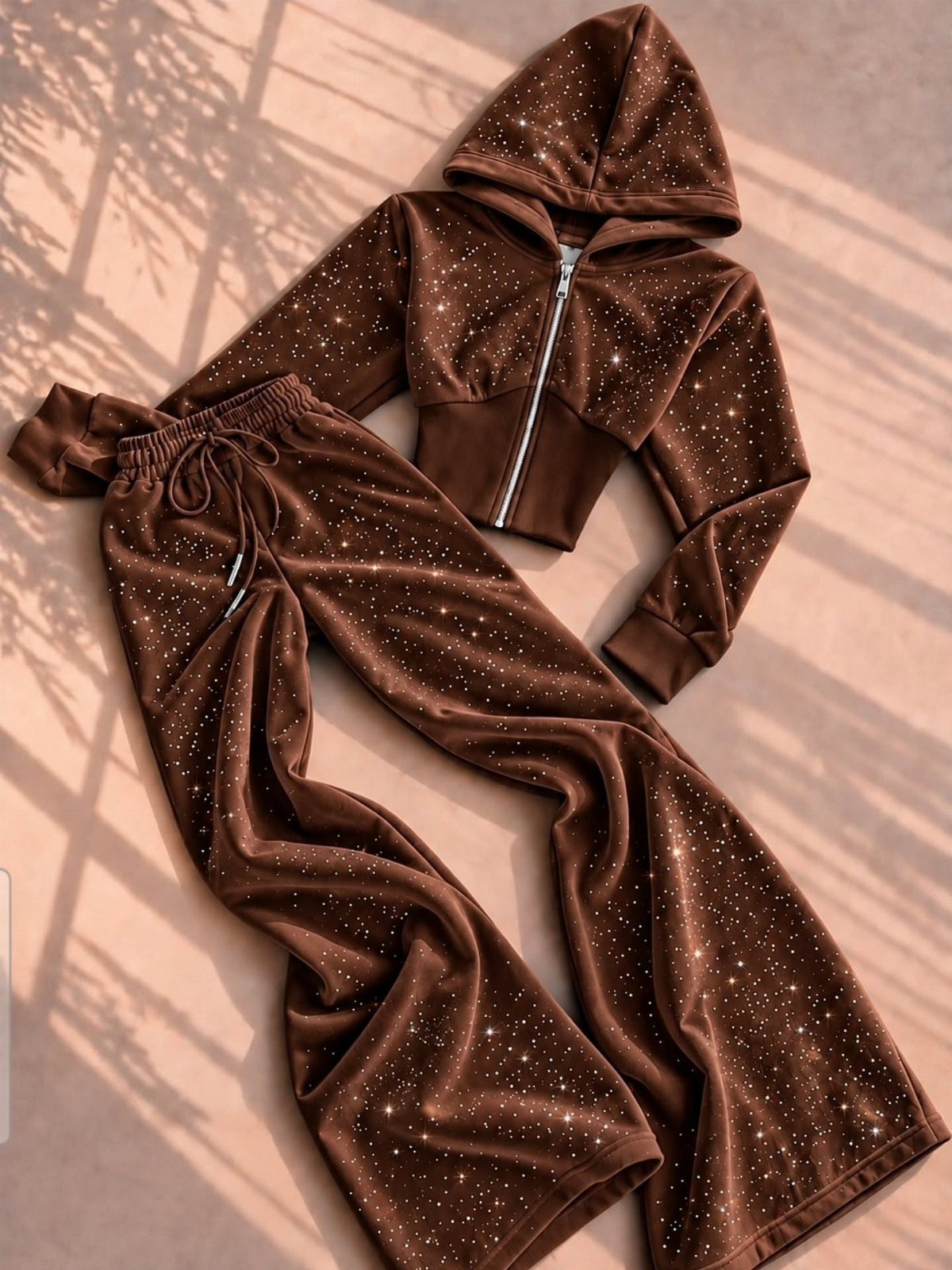 Brown velvet rhinestone tracksuit with cropped hoodie and wide-leg pants on light background