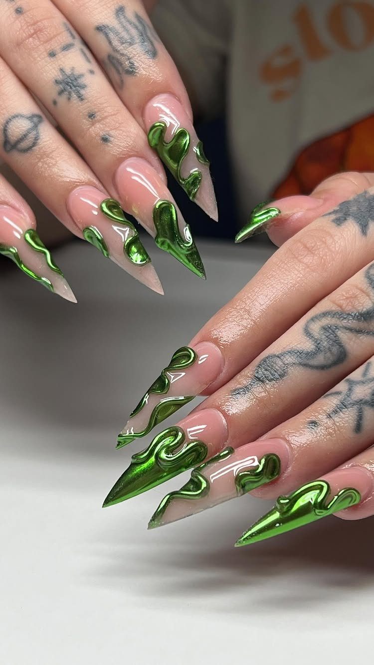 Almond shaped nails with nude polish and 3D metallic green swirl designs