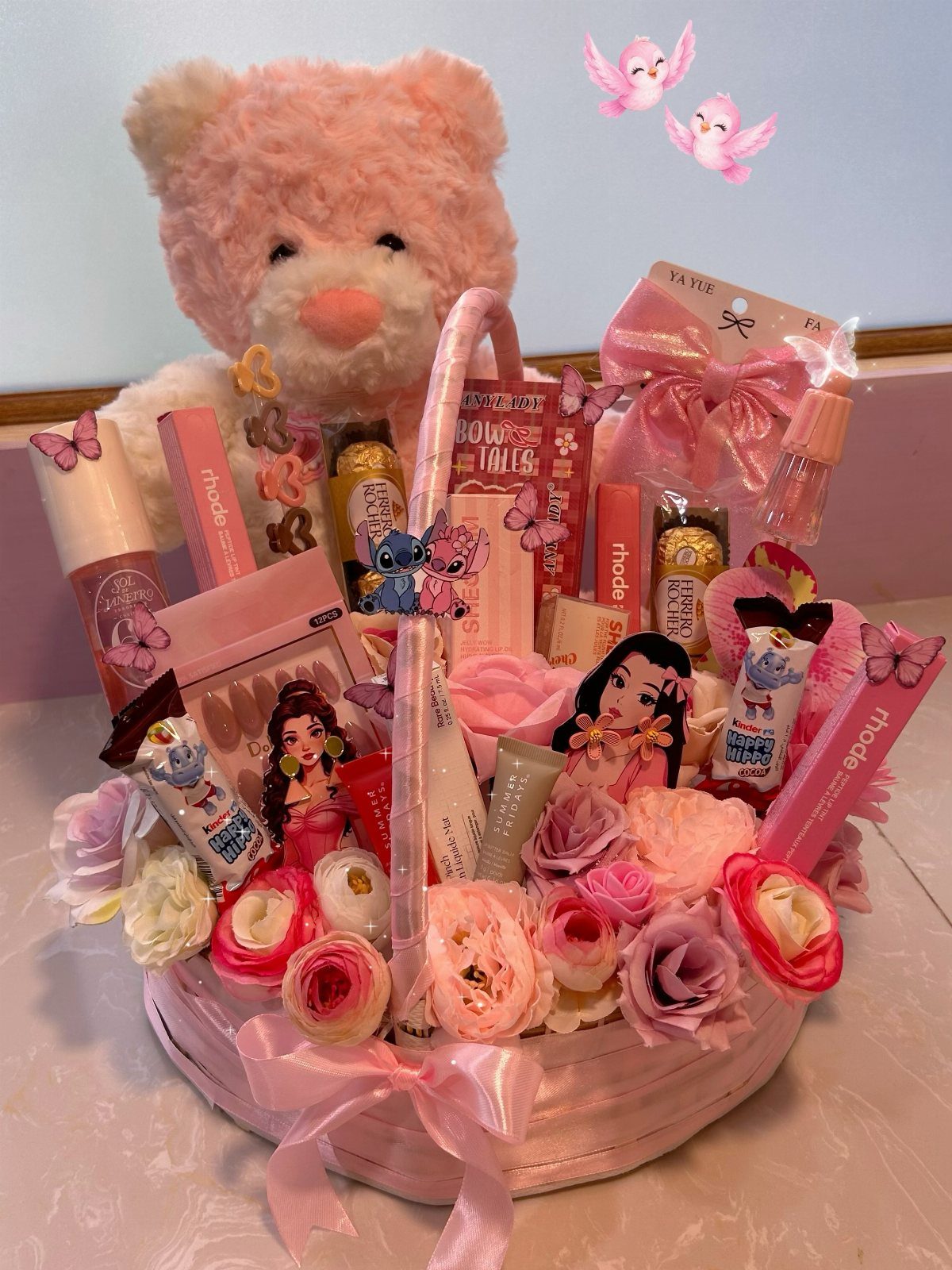 Pink gift basket filled with skincare products, roses, and a pink teddy bear.