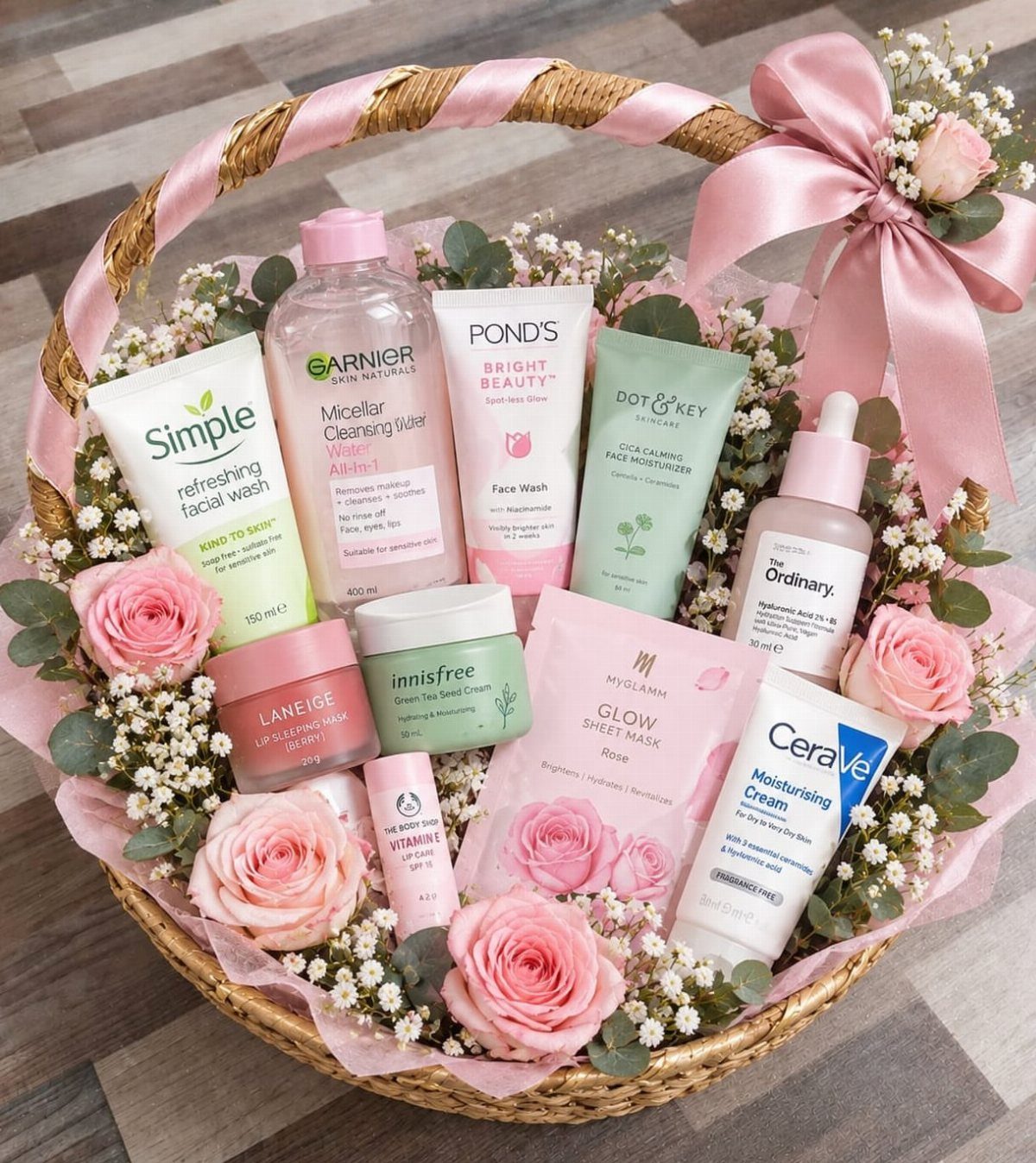 Skincare gift basket with pink roses and various beauty products for pampering.