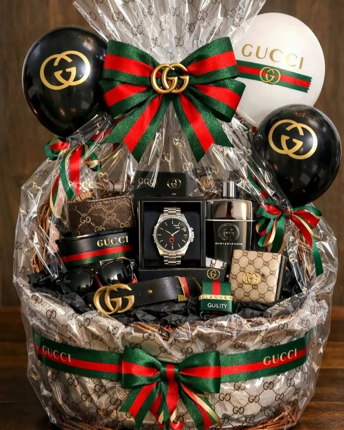 Luxury gift basket for men with watch, perfume, and designer accessories and balloons.