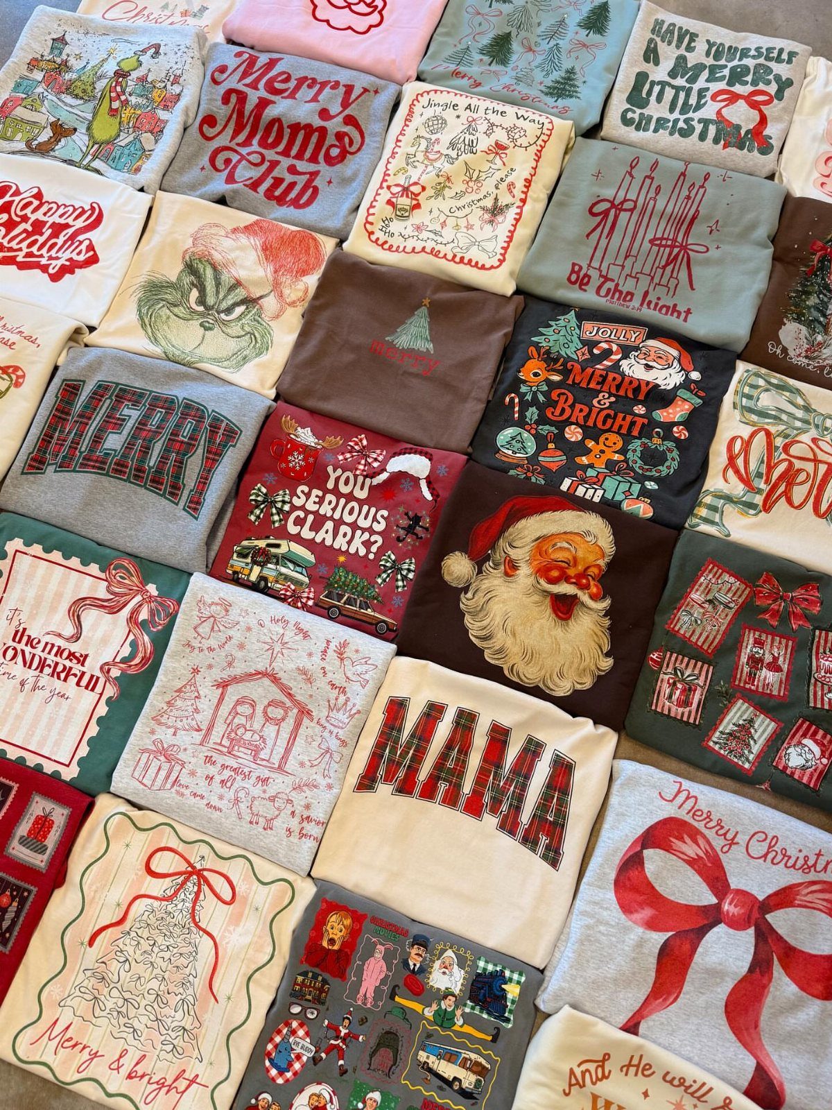Christmas themed shirts and sweatshirts folded in a grid with festive holiday graphics.