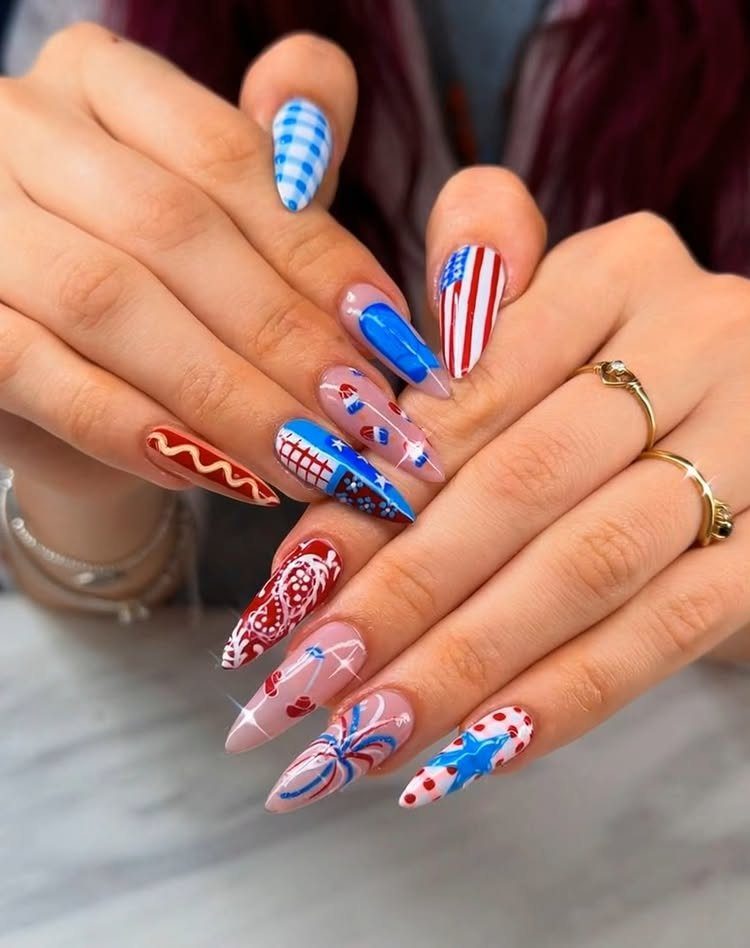 Patriotic red, white, and blue nail art with stars and stripes on almond nails.